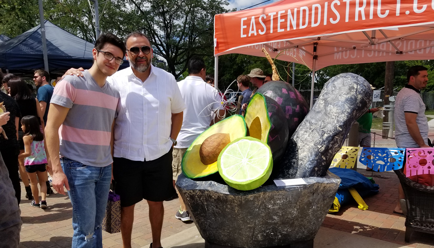 Page Senior Principal Art Chavez at PiñataFest 2018 with his son Matias. - Page