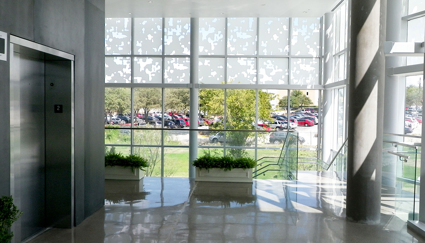 A view from the new Fort Worth Baylor Surgical Hospital overlooking the adjacent, partially shaded parking lot. - Page