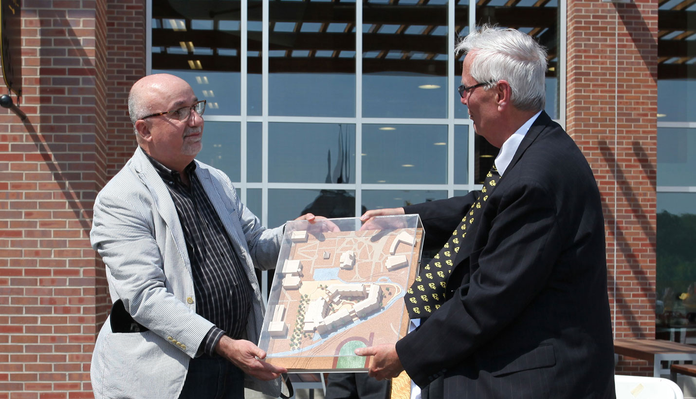 Page Principal Christopher Carvell presenting model of Shocker Hall to Wichita State University President, John Bardo - Page