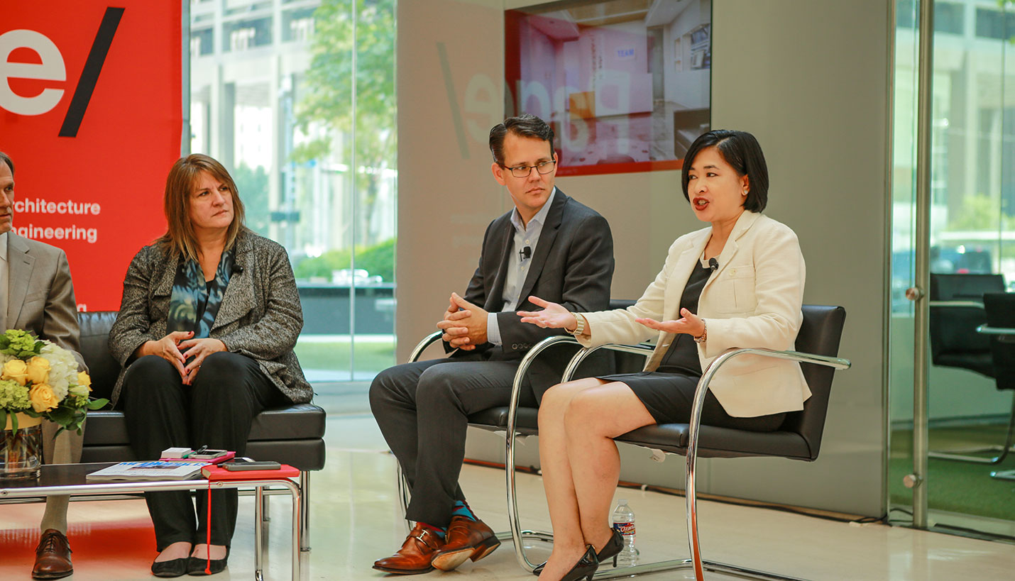 Kris Walsh and David Euscher listen to Marissa Yu discuss cultural evolutions in the workplace. - Page