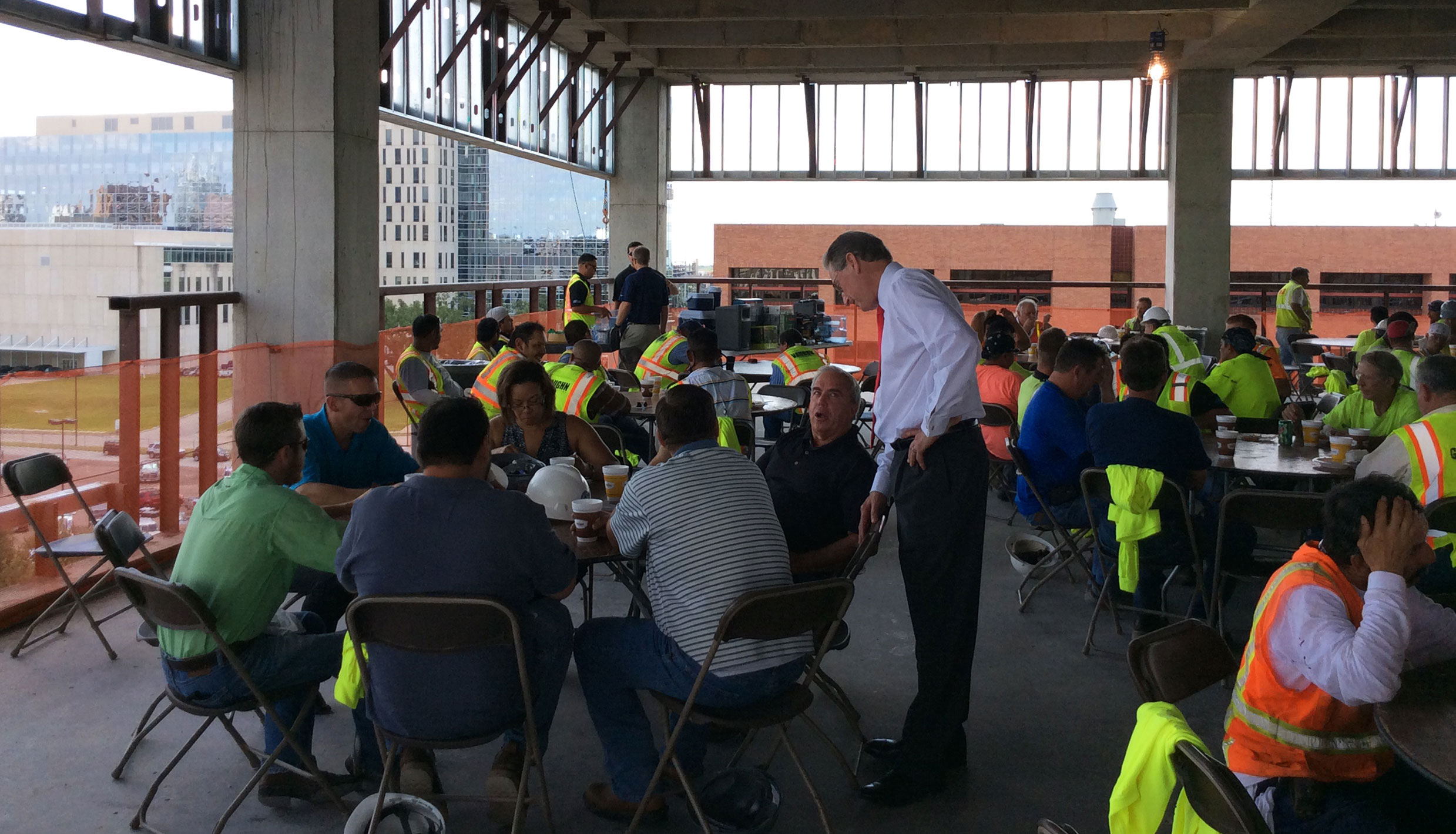 Page Principal Jeff Bricker (standing) talks with other members of the IFS project team. - 