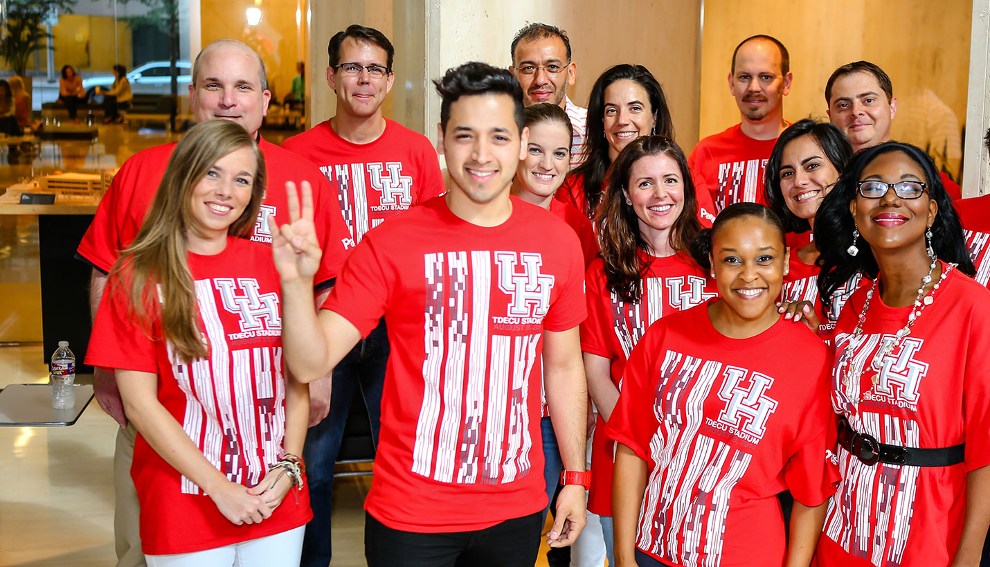 Gibran Villalobos, center, won the Page T-shirt design contest to commemorate the inauguration of our TDECU Football Stadium at the University of Houston. - Andy Phan, Page Director of Visualization